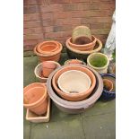 A SELECTION OF PLANT POTS approximately twenty plant pots of different sizes to include enamelled