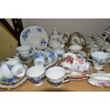 A GROUP OF CERAMIC TEAWARES, comprising a thirty two piece Royal Vale teaset printed with