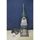 A BISSELL POWERWASH 1960J UPRIGHT CARPET CLEANER along with a VAX blade cordless vacuum cleaner (
