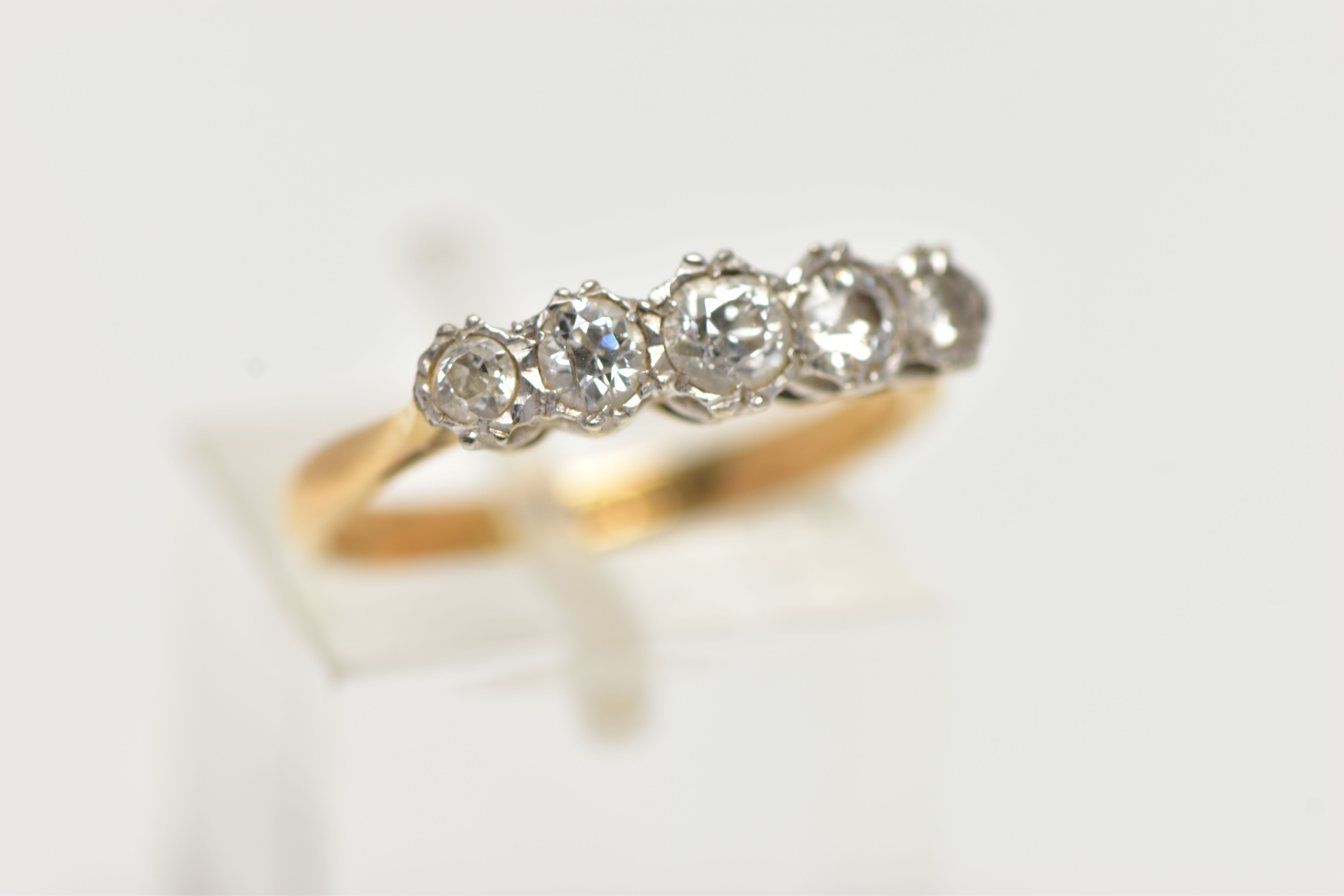 A YELLOW METAL, FIVE STONE DIAMOND RING, set with five graduating, old cut diamonds, estimated total - Image 4 of 4
