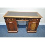 A VICTORIAN WALNUT KNEE HOLE DESK, with a brown leather writing surface, three frieze drawers,