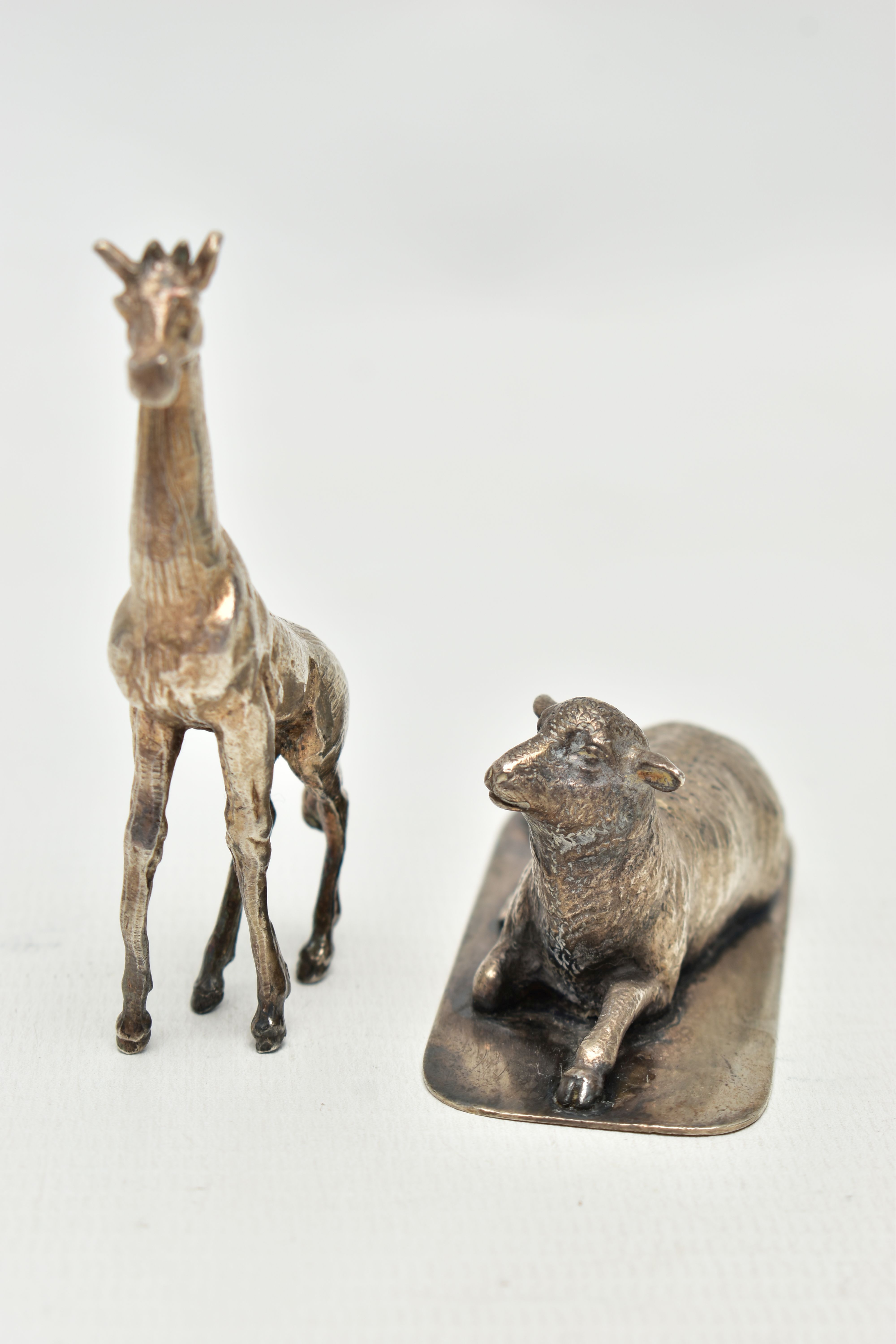 TWO WHITE METAL FIGURES, to include a silver giraff, import marks for London, 1974, approximate - Image 2 of 5