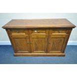 A REPRODUCTION WALNUT SIDEBOARD, with three drawers, above three cupboard doors, length 137cm x