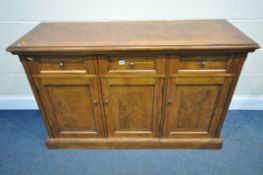 A REPRODUCTION WALNUT SIDEBOARD, with three drawers, above three cupboard doors, length 137cm x