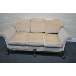 A VICTORIAN STYLE SOFA, covered in beige fabric, on a wooden base on cabriole legs, with ball and