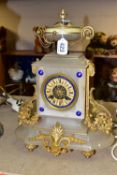 A FRENCH MANTEL CLOCK, white onyx body with foliate gilt decoration, hand painted face with a blue