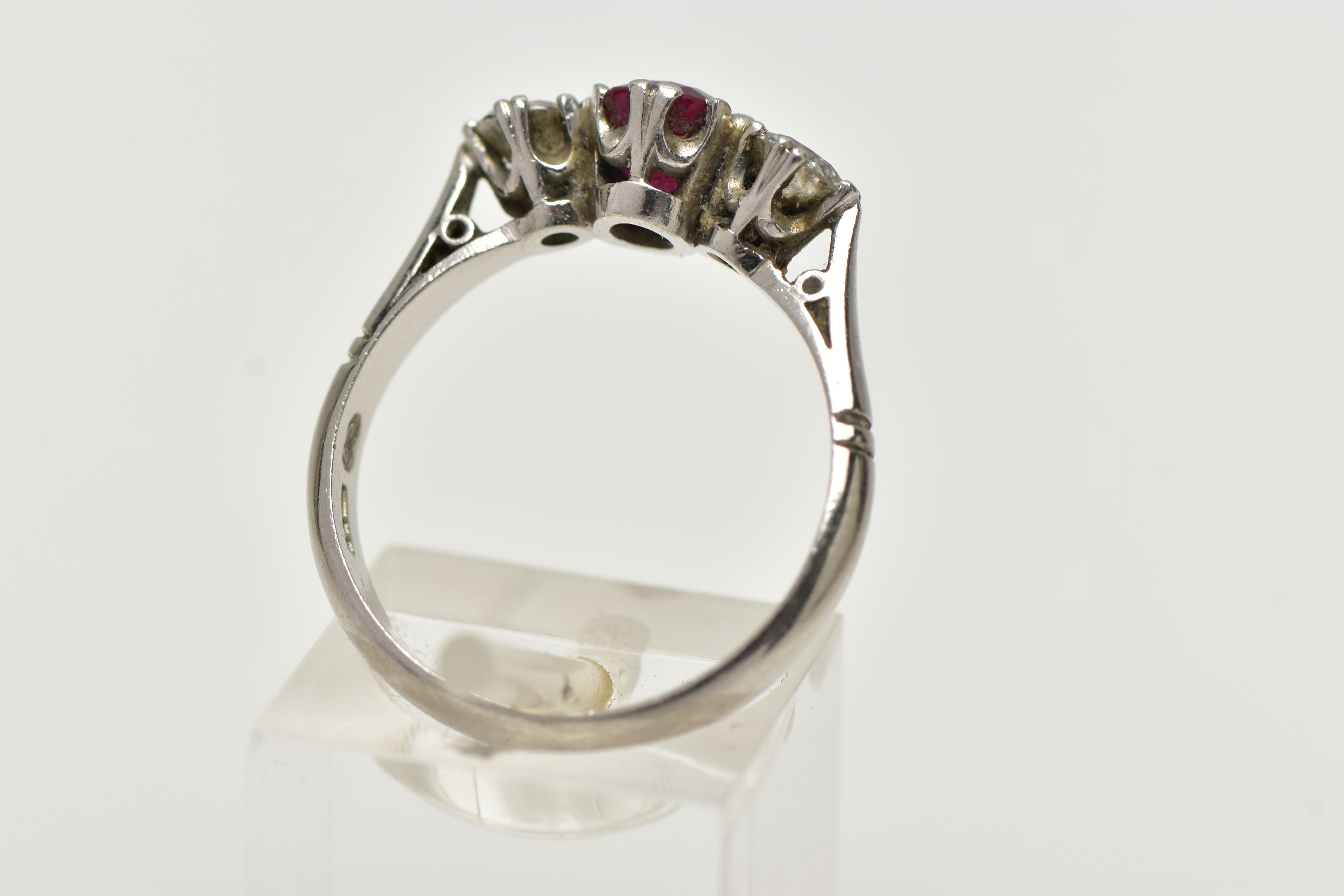 A PLATINUM RUBY AND DIAMOND THREE STONE RING, centering on an oval cut ruby, - Image 3 of 4
