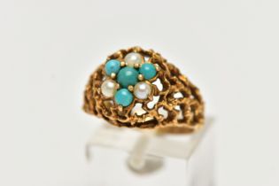 A YELLOW METAL GEMSET DOME RING, a textured open work ring, cluster set with three split pearls