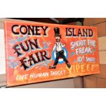 A REPRODUCTION AMERICAN FAIRGROUND SIGN 'CONEY ISLAND FUN FAIR', brightly coloured paint on wooden