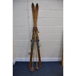 A PAIR OF VINTAGE WOODEN SKI'S branded with Stratos along with a pair of bamboo and leather ski