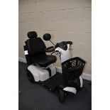 A CARECO VEGA RS MOBILITY SCOOTER with rain cover, backpack/organiser, condition-good used condition