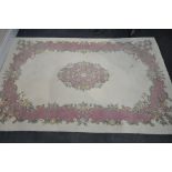 A LATE 20TH CENTURY CREAM AND PINK CHINESE RUG, 237cm x 148cm