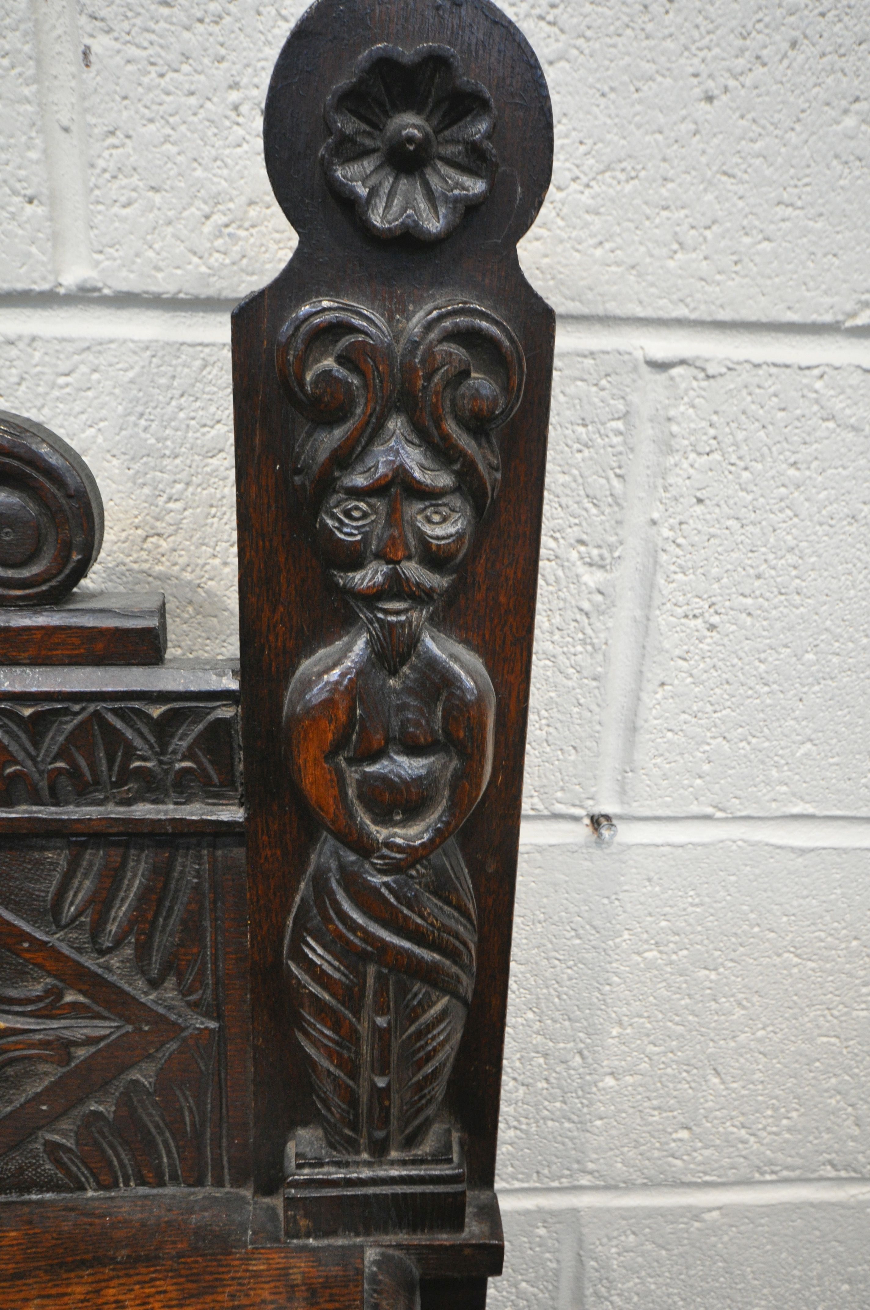 A LATE 19TH/EARLY 20TH CENTURY CARVED OAK SIDE TABLE, the raised back with a single shelf, depicting - Image 3 of 6