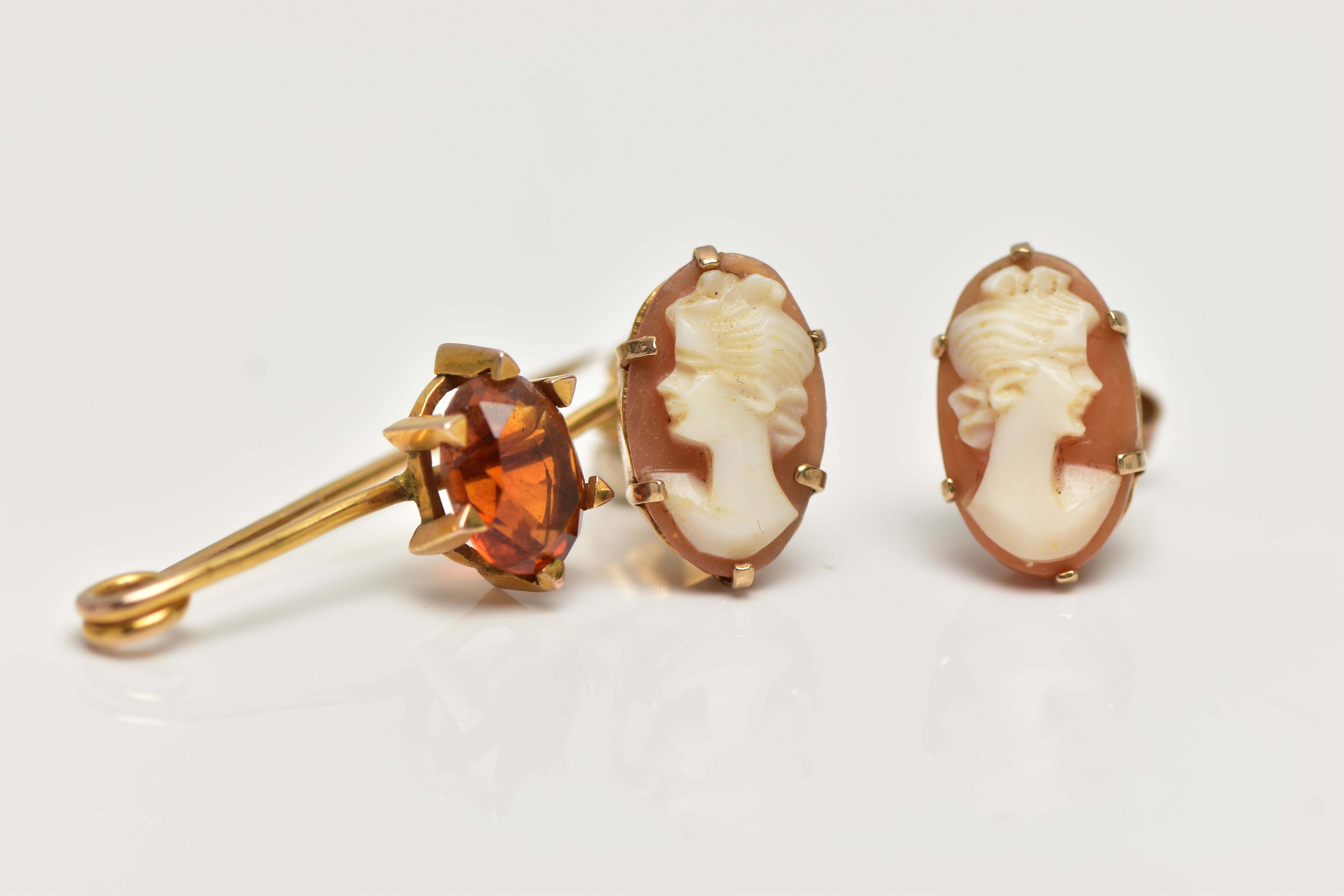 A CITRINE BROOCH AND A PAIR OF CAMEO EARRINGS, the brooch claw set with an oval cut citrine, to - Image 3 of 4