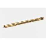 A 9CT GOLD SWIZZEL STICK, polished case, stamped 9ct gold, closed length 80mm, approximate gross