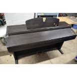 A YAMAHA CLAVINOVA CLP-920 ELECTIC PIANO with music sheet holder measuring width 136cm x depth