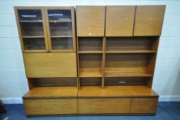 A MID CENTURY THREE SECTION TEAK WALL SHELVING UNIT, in two sections, including an arrangement of