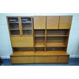 A MID CENTURY THREE SECTION TEAK WALL SHELVING UNIT, in two sections, including an arrangement of