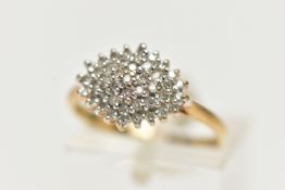 A 9CT YELLOW GOLD, DIAMOND CLUSTER RING, of a marquise shape, set with single cut diamonds,