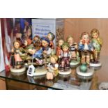 A GROUP OF TWELVE HUMMEL GOEBEL FIGURINES, comprising 'Grandma's Girl' 561 (1989), 'On Holiday'