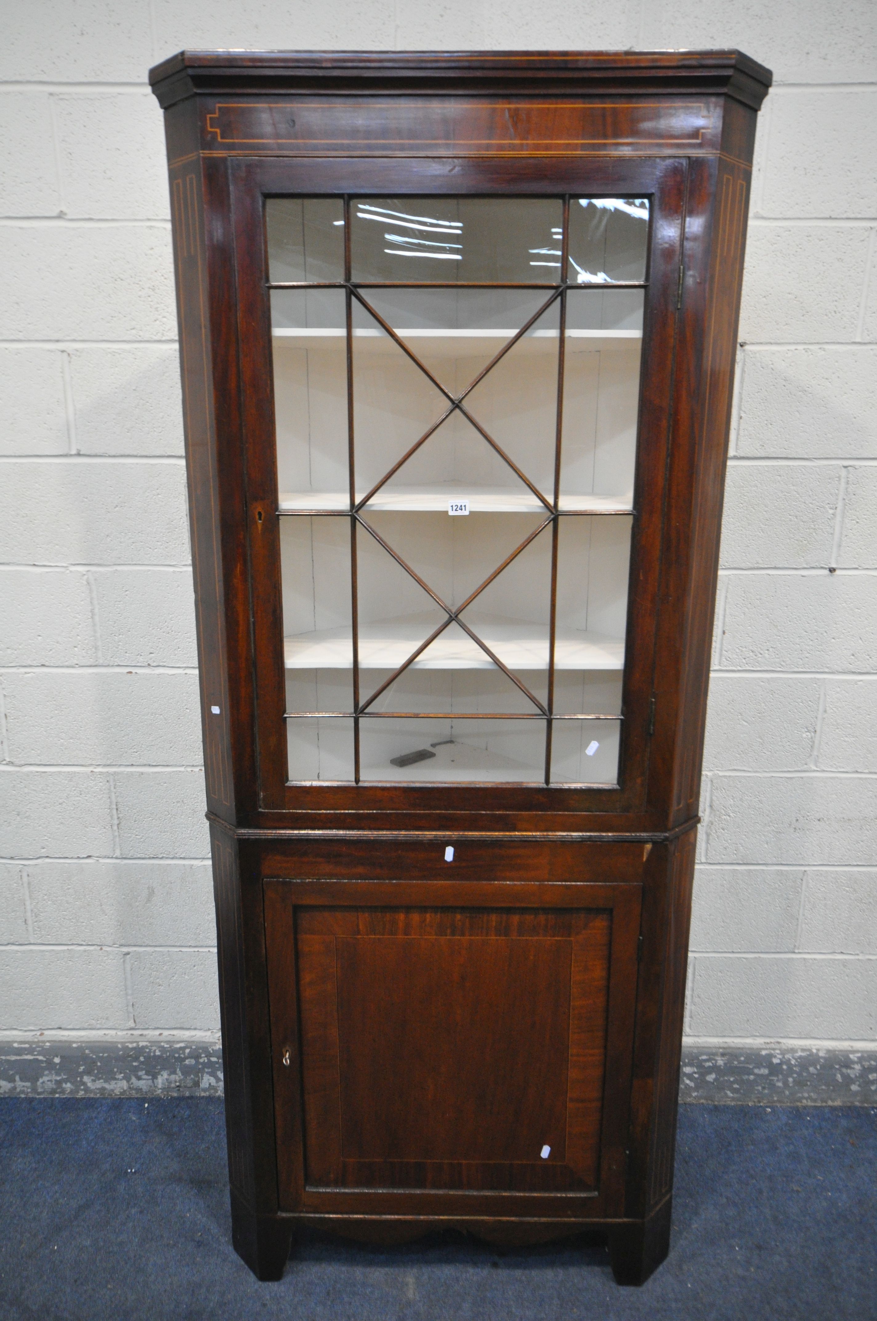 A GEORGIAN MAHOGANY AND INLAID CORNER CUPBOARD, the top section with a single astragal glazed door