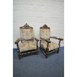 A PAIR OF EARLY 20TH CENTURY ARMCHAIRS, with open foliate surmounts, padded open armrests, on barley