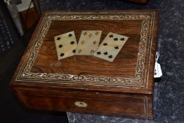 A PLAYING CARD BOX, the hinged lid having three inlaid mother of pearl playing cards inside a