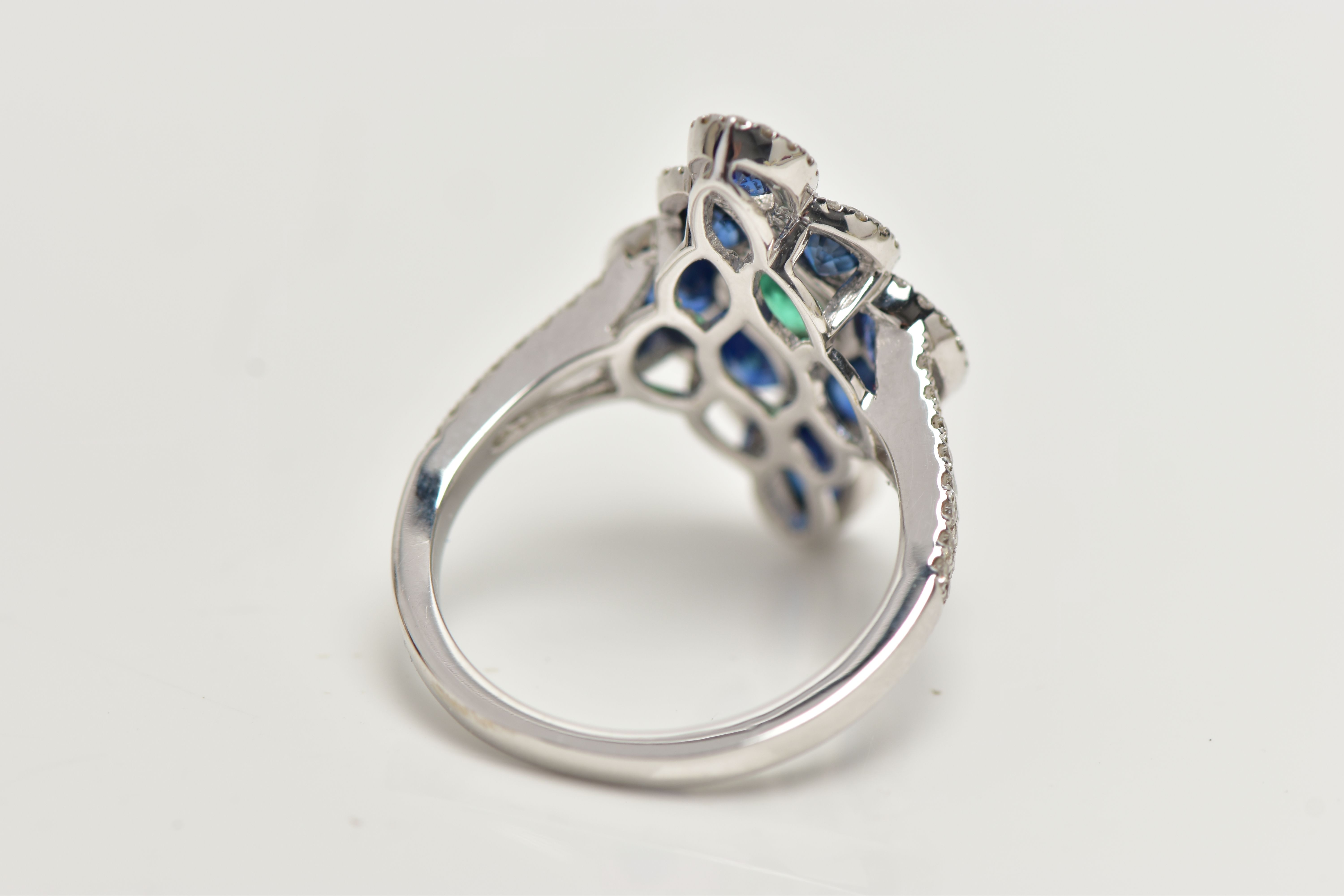 AN 18CT WHITE GOLD GEM SET DRESS RING, of a marquise outline, set to the centre is an oval cut - Image 3 of 4