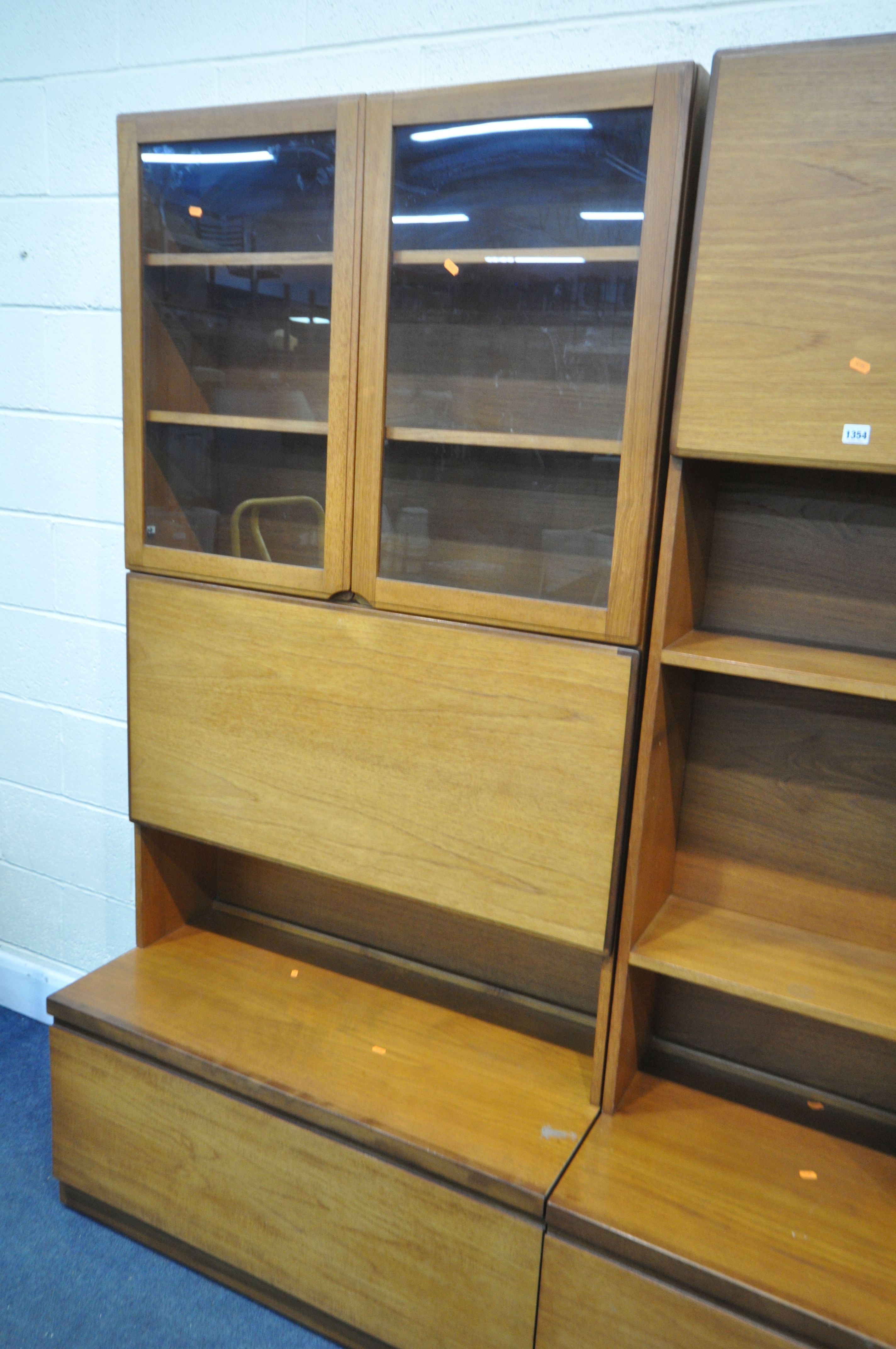 A MID CENTURY THREE SECTION TEAK WALL SHELVING UNIT, in two sections, including an arrangement of - Image 3 of 5