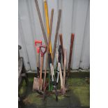 A SELECTION OF GARDEN TOOLS to include rakes, spade, lawn edger, pick axe etc