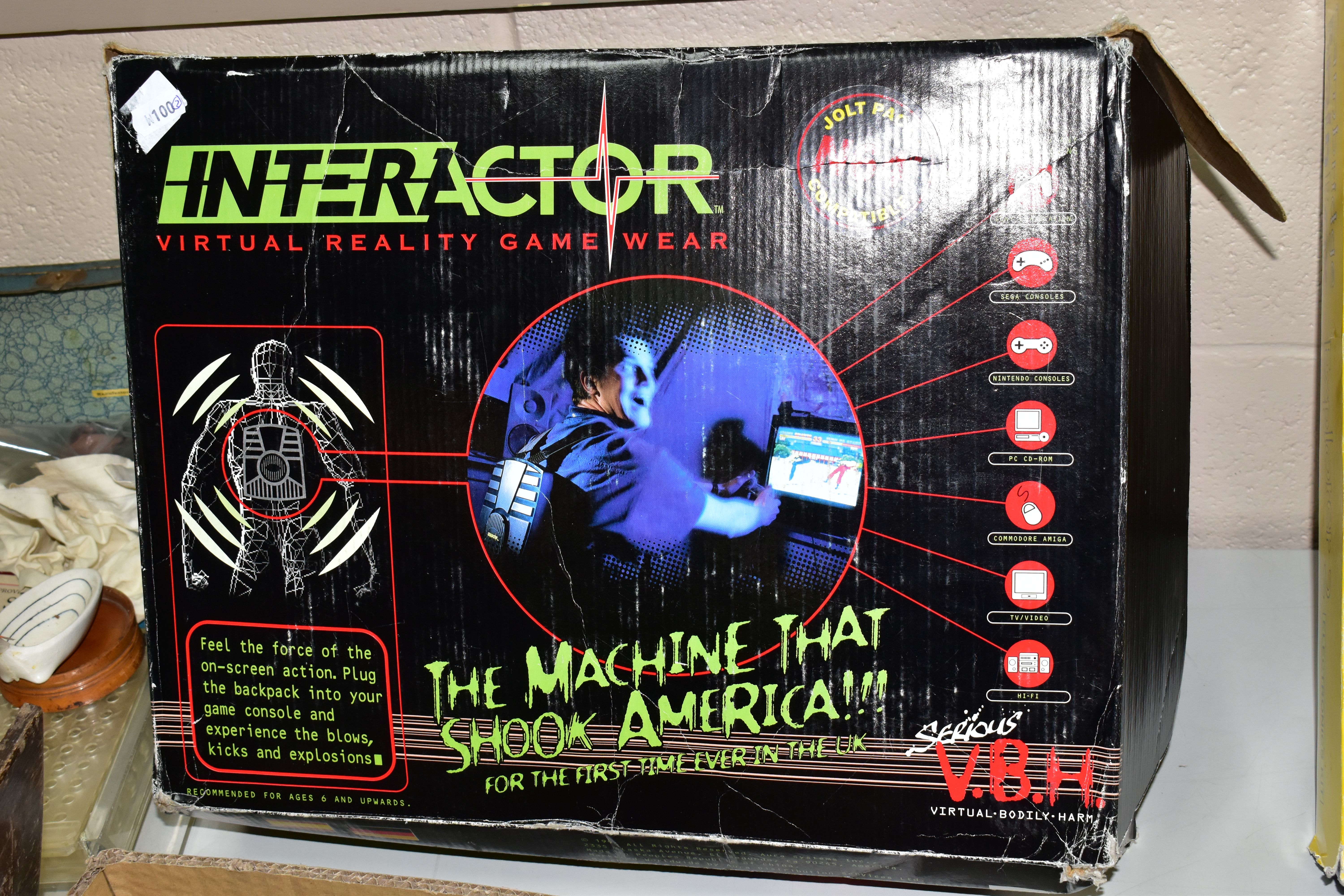 A BOXED AURA INTERACTOR VIRTUAL REALITY GAME WEAR SET, Backpack, Amplifier and Transformer and