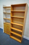 A WHITE FINISH AND PINE OPEN BOOKCASE, with an arrangement of shelving and a double cupboard door,