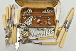 A SMALL BOX OF ITEMS, to include a green travel jewellery box, with contents of costume brooches,