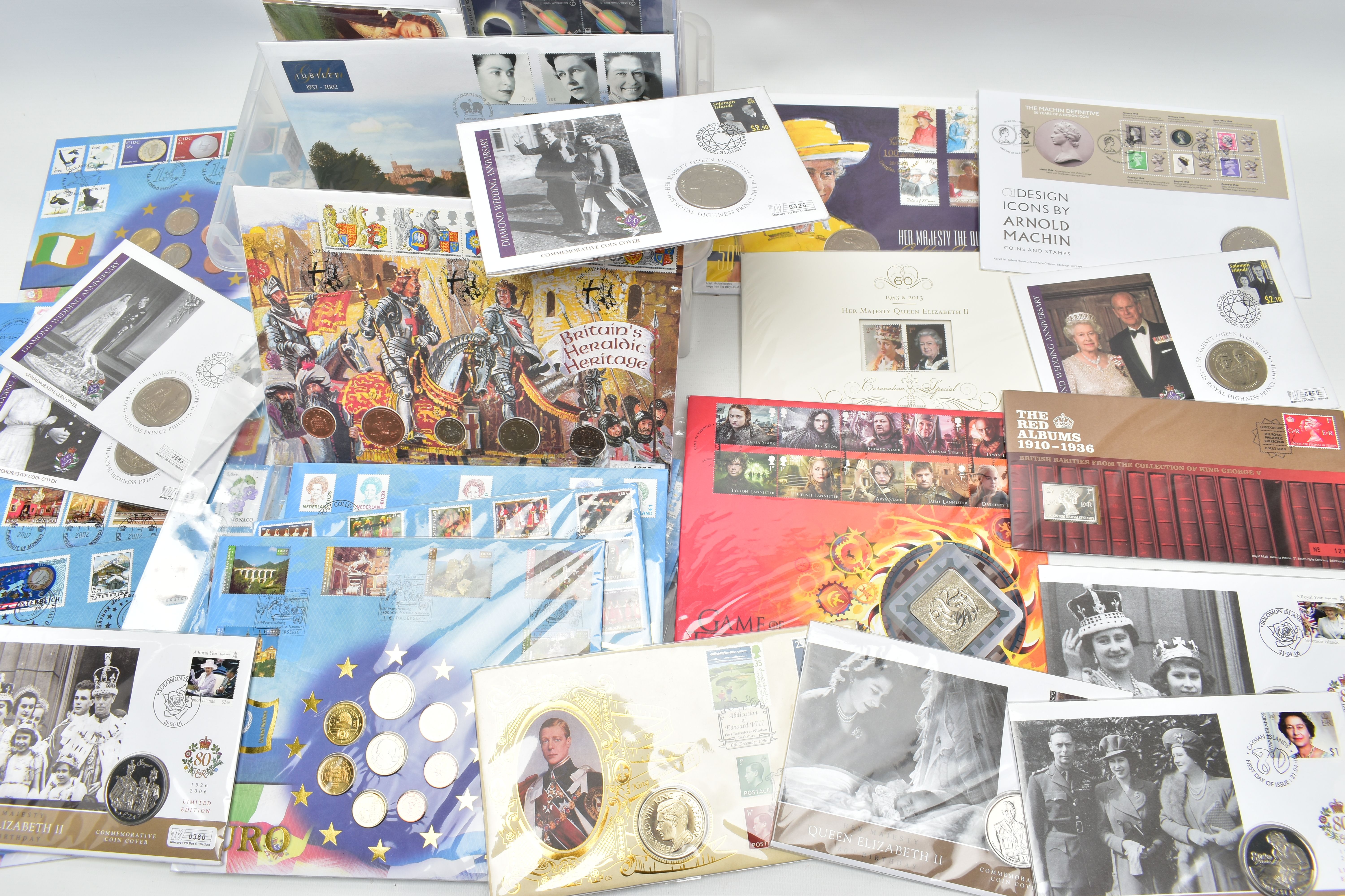 A PLASTIC TUB CONTAINING A LARGE AMOUNT OF FIRST DAY AND COMMEMORATIVE COIN COVERS, to include 14x