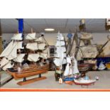 A GROUP OF FIVE MODEL SHIPS, comprising a wooden galleon (damaged around bow), an unnamed sailing