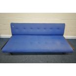 A MID-CENTURY TEAK SOFA BED, covered in blue fabric, (condition:-mechanism works as should,