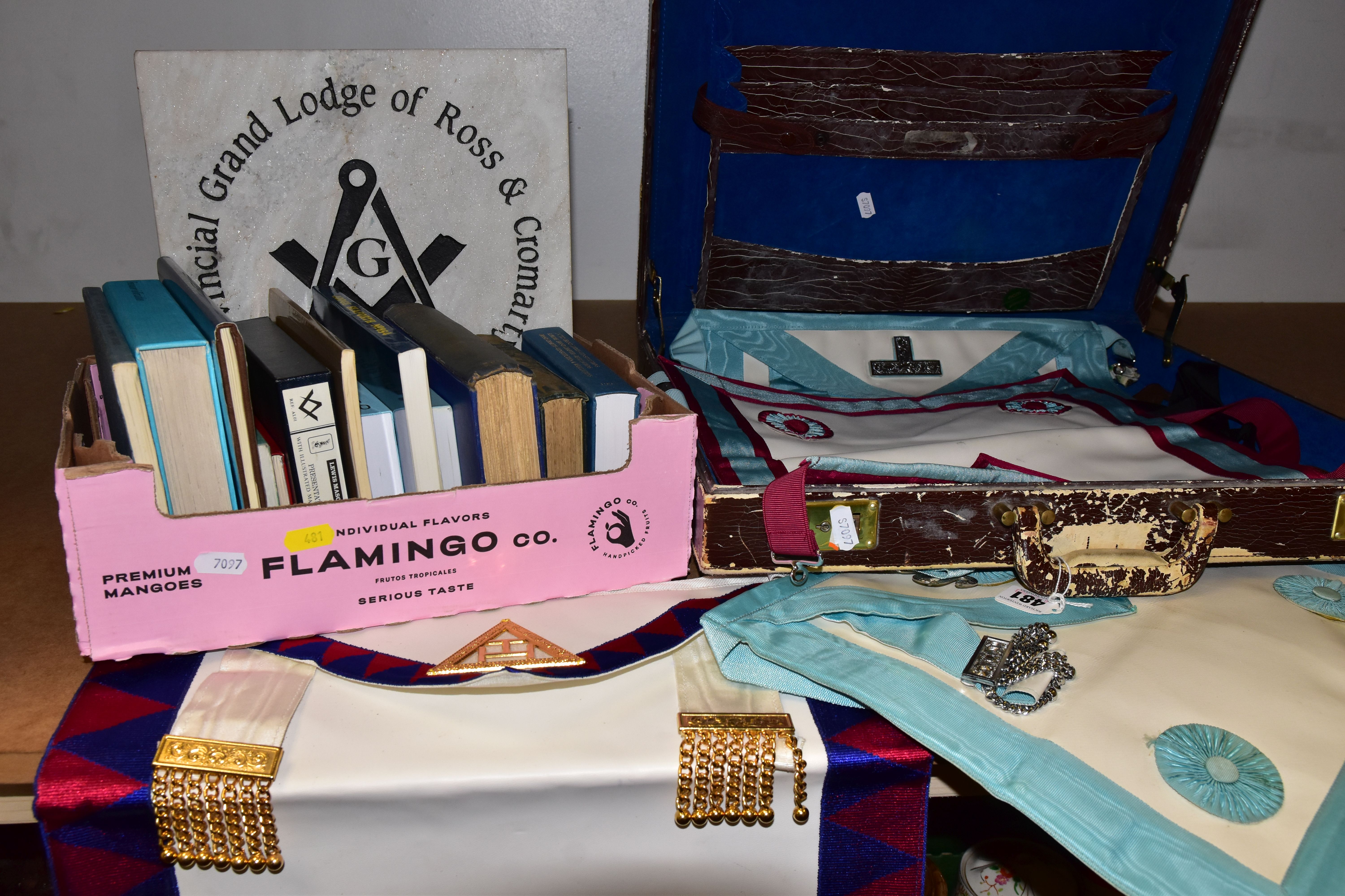 FREEMASONRY INTEREST, A BOX AND A BRIEFCASE OF RELATED ITEMS, to include four aprons, a stone plaque