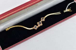 A 18CT GOLD DIAMOND AND SAPPHIRE BRACELET, three oval cut blue sapphires each set in a quatrafoil