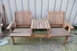 A WOODEN TWO SEAT GARDEN BENCH two single seat garden bench joined by a table in the centre