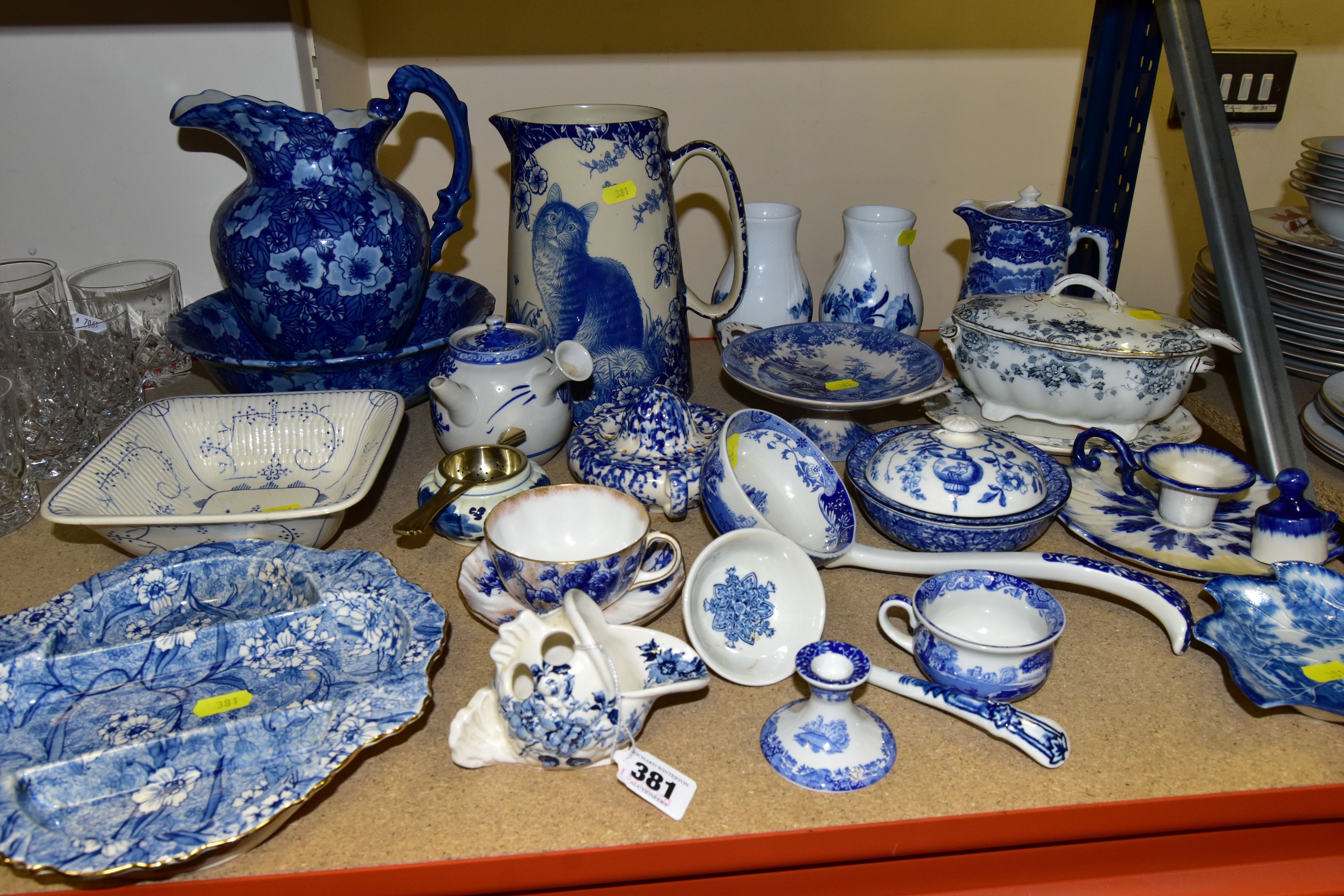 A COLLECTION OF BLUE AND WHITE CERAMICS, comprising a Staffordshire ironstone candle holder, a