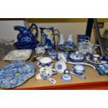 A COLLECTION OF BLUE AND WHITE CERAMICS, comprising a Staffordshire ironstone candle holder, a