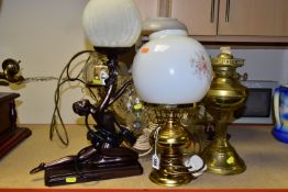 A GROUP OF TABLE LAMPS, comprising an Art Deco style figural table lamp, height 48cm to top of globe