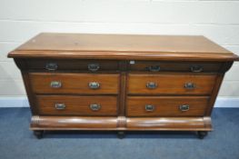A 19TH CENTURY MAHOGANY DRESSER BASE, with an assortment of six drawers, on bulbous feet, length