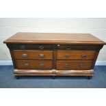 A 19TH CENTURY MAHOGANY DRESSER BASE, with an assortment of six drawers, on bulbous feet, length