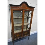 AN EDWARDIAN MAHOGANY MARQUETRY INLAID TWO DOOR DISPLAY CABINET, enclosing two shelves, on square