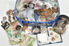 A BISCUIT TIN CONTAINING MIXED COINAGE TOGETHER WITH SOME DISTRESSED BANKNOTES