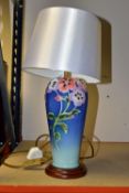 A FRANZ PORCELAIN 'PANSY' FZO0285 table lamp, decorated with multi coloured pansies on a blue and