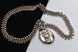 A LATE 19TH CENTURY LOCKET AND CHAIN, oval form silver locket detailed with a belt and buckle