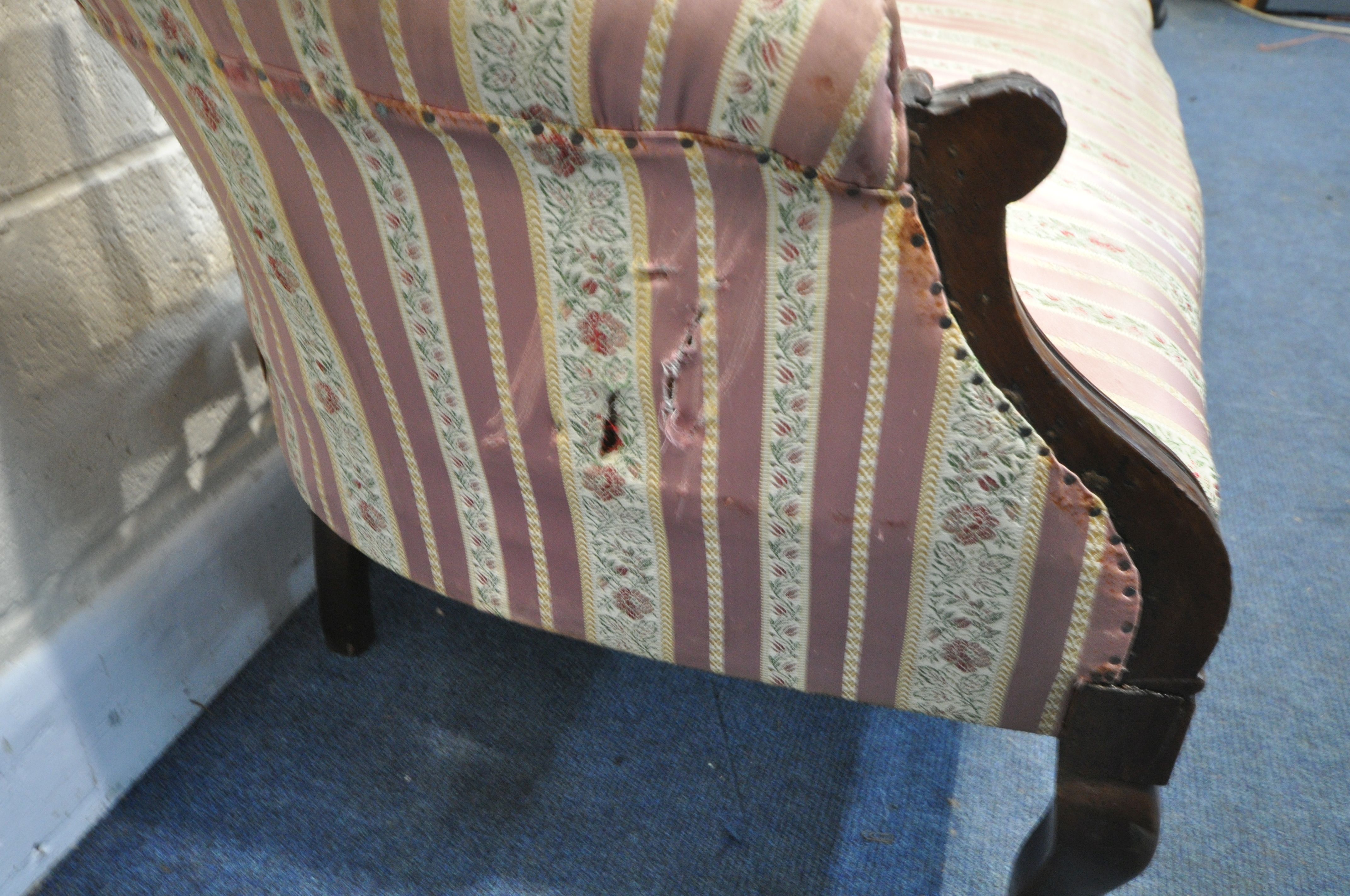A 19TH CENTURY MAHOGANY SOFA, with carved open fretwork back, on stripped and floral upholstery, - Image 4 of 5