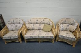 A WICKER CONSERVATORY LOUNGE SUITE, comprising a two seater sofa, and a pair of armchair (3)